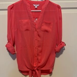 Coral colored button down blouse